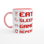 White and pink ceramic "Eat Sleep Game Repeat" gaming mug with red pixel art icons and Japanese kanji text for eat, sleep, game and repeat – funny gamer gift mug