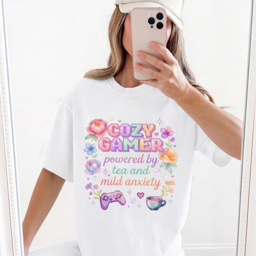 Cozy Gamer powered by tea and mild anxiety white oversized t-shirt mirror selfie – pastel floral pixel art gaming tee worn – kawaii gamer girl aesthetic