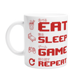 White ceramic "Eat Sleep Game Repeat" gaming mug with red pixel art icons and Japanese kanji text for eat, sleep, game and repeat – funny gamer gift mug