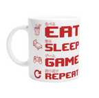 White ceramic "Eat Sleep Game Repeat" gaming mug with red pixel art icons and Japanese kanji text for eat, sleep, game and repeat – funny gamer gift mug